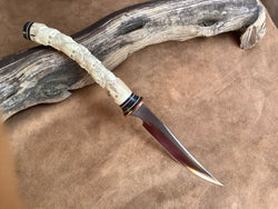 25-146 - Skull Stack Carved Deer Antler Carver