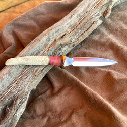 23-26  Raven w/ Celtics knots Carved Deer Antler Stabilized Red Dyed Maple Burl, natural Linen Micarta